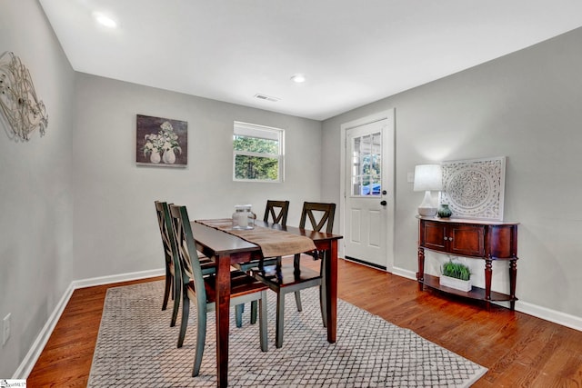 dining room with wood-type flooring