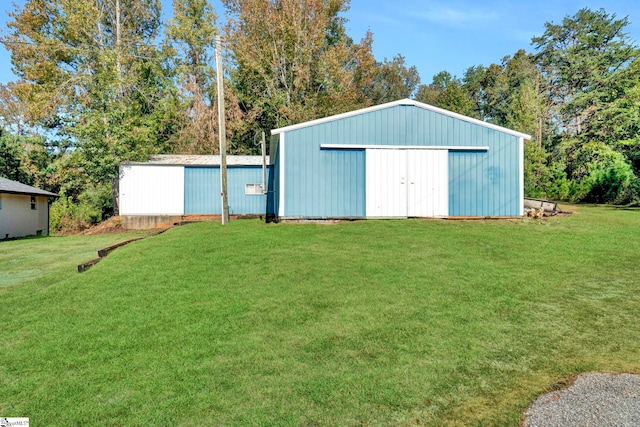 view of outbuilding featuring a yard