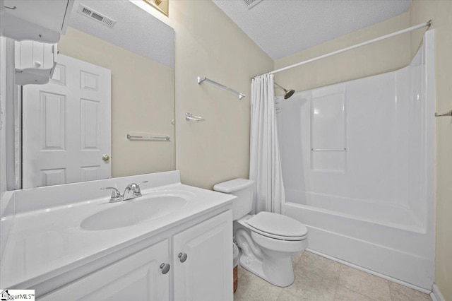 full bathroom featuring toilet, vanity, shower / bath combo, and a textured ceiling