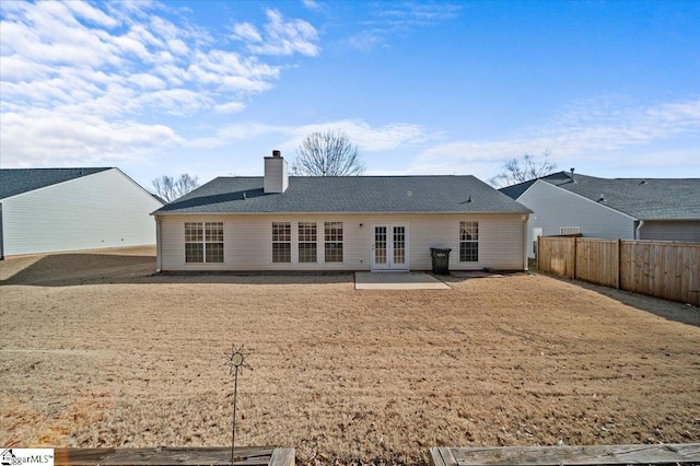 rear view of property with french doors and a patio area