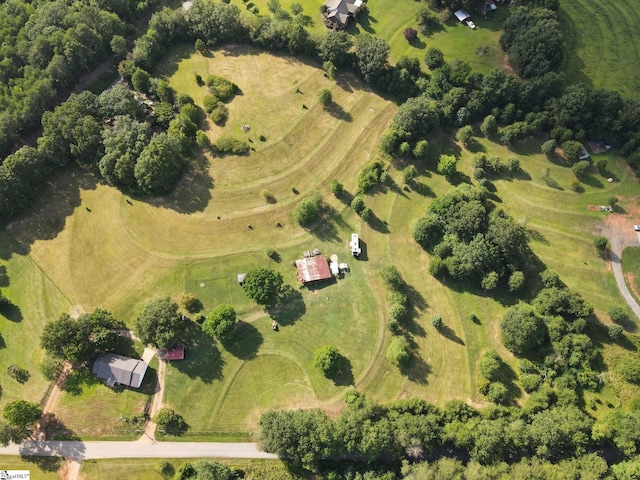 birds eye view of property with a rural view