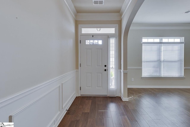 entryway featuring dark hardwood / wood-style flooring and ornamental molding