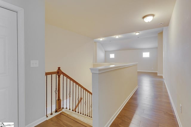 hallway with hardwood / wood-style floors