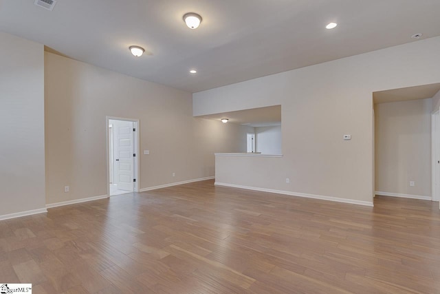 empty room with light hardwood / wood-style floors