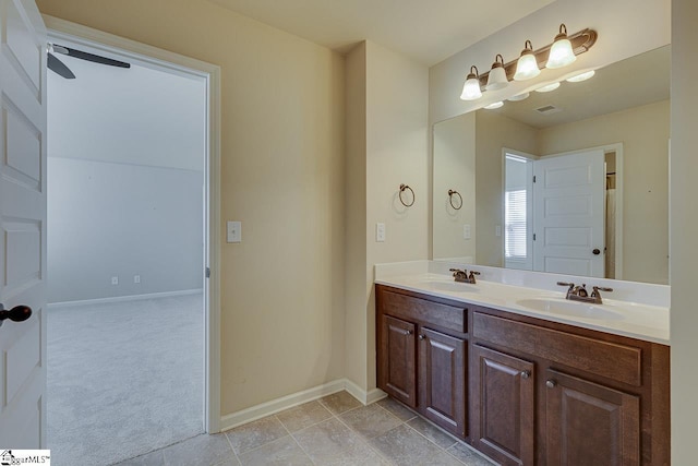 bathroom featuring ceiling fan and vanity