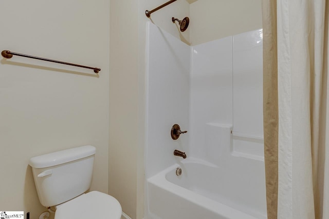 bathroom featuring toilet and shower / washtub combination