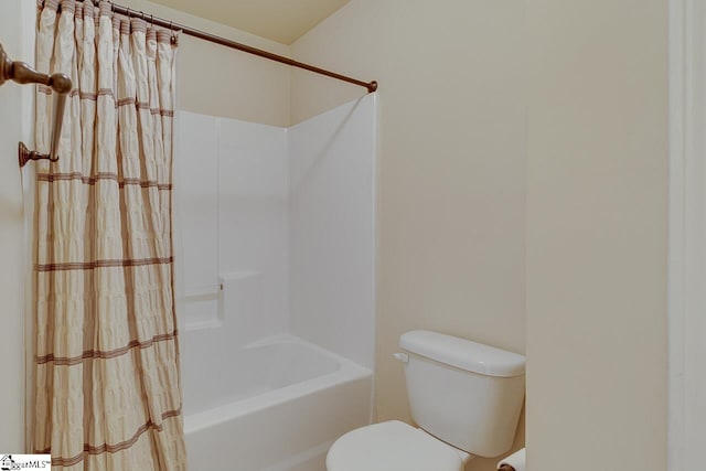 bathroom with shower / bathtub combination and toilet