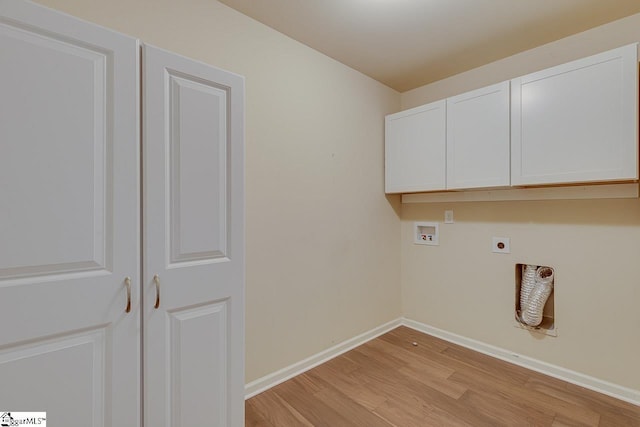 laundry room featuring washer hookup, cabinets, hookup for an electric dryer, and light wood-type flooring