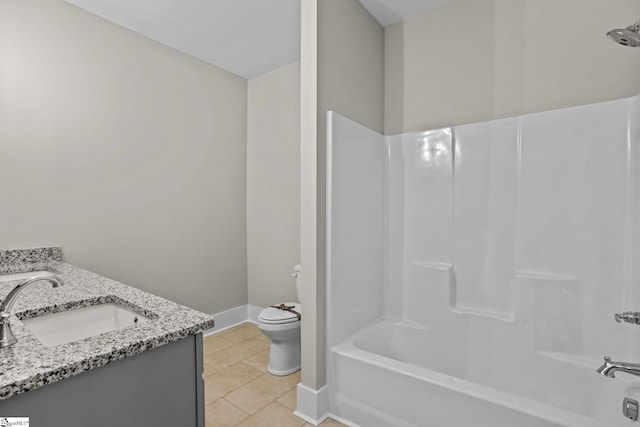 full bathroom featuring toilet, tile patterned flooring, bathing tub / shower combination, and vanity