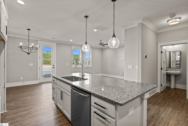 kitchen featuring stainless steel dishwasher, white cabinetry, sink, and a kitchen island with sink