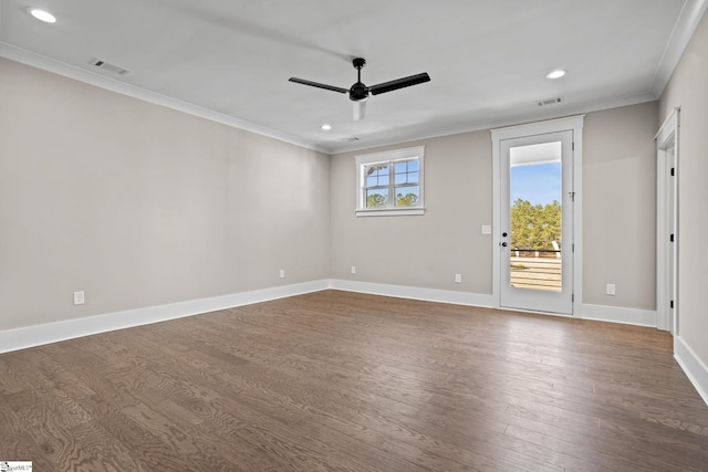 empty room featuring wood-type flooring, ornamental molding, and ceiling fan