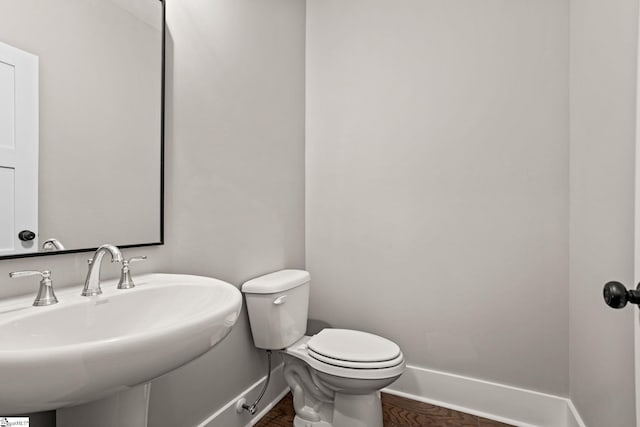 bathroom featuring sink and toilet