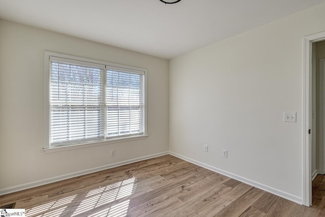 empty room with light wood-type flooring