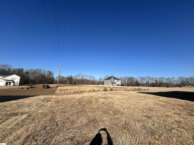 view of yard with a rural view