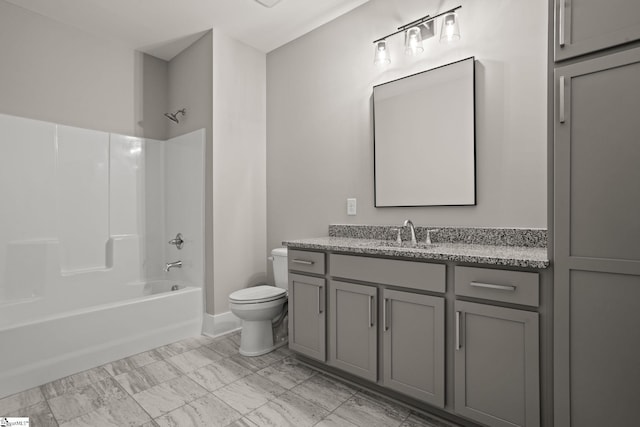 full bathroom featuring  shower combination, vanity, and toilet