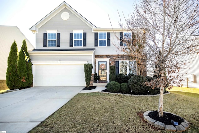 view of front facade featuring a front yard and a garage