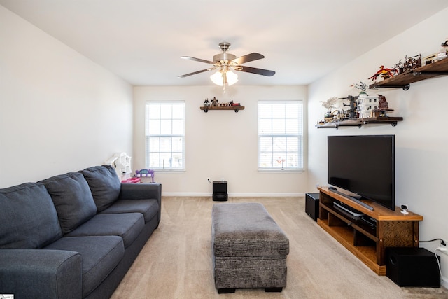 carpeted living room with ceiling fan