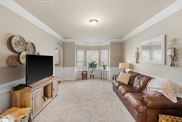 living room featuring ornamental molding and light carpet