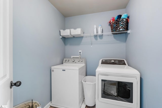 washroom with washing machine and clothes dryer