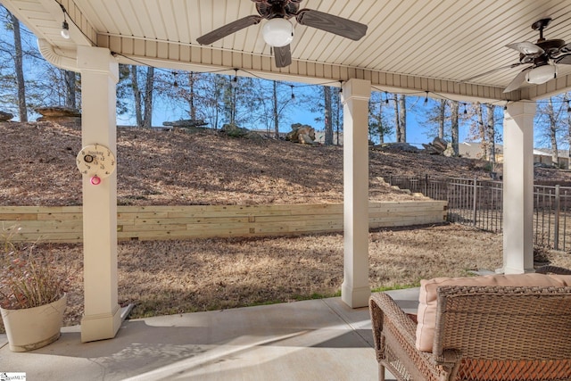 view of patio featuring ceiling fan