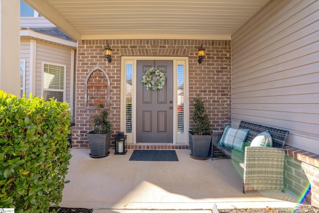 property entrance with covered porch