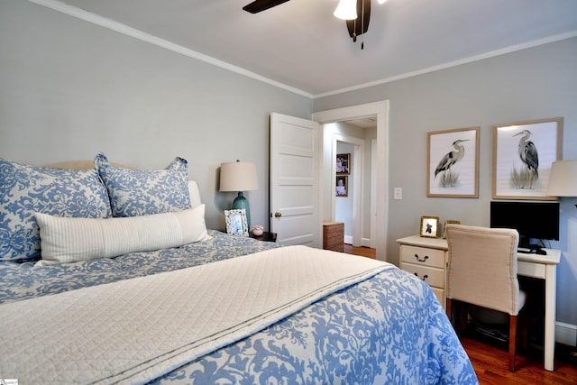 bedroom with ceiling fan, dark wood-type flooring, and ornamental molding