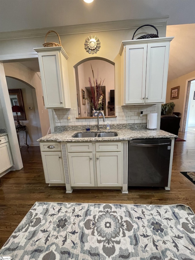 kitchen with sink, stainless steel dishwasher, light stone counters, and tasteful backsplash