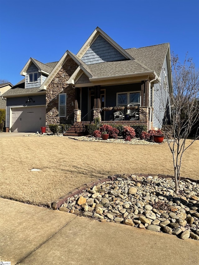 craftsman house with a garage and covered porch