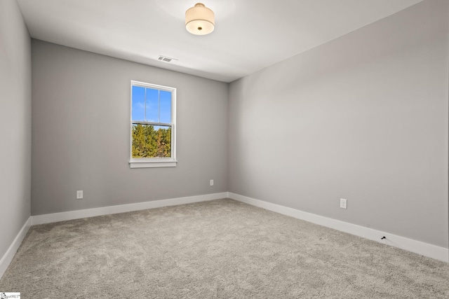 spare room featuring carpet flooring