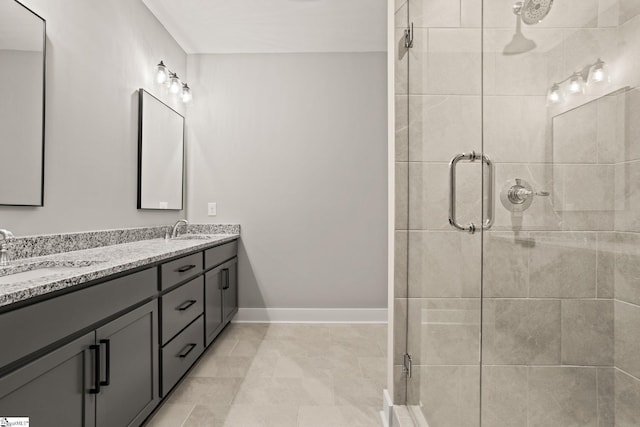 bathroom featuring vanity and a shower with shower door