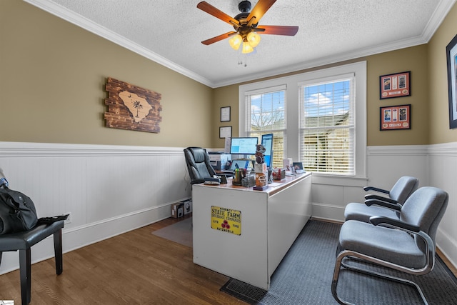 office space with ceiling fan, a textured ceiling, dark hardwood / wood-style flooring, and crown molding