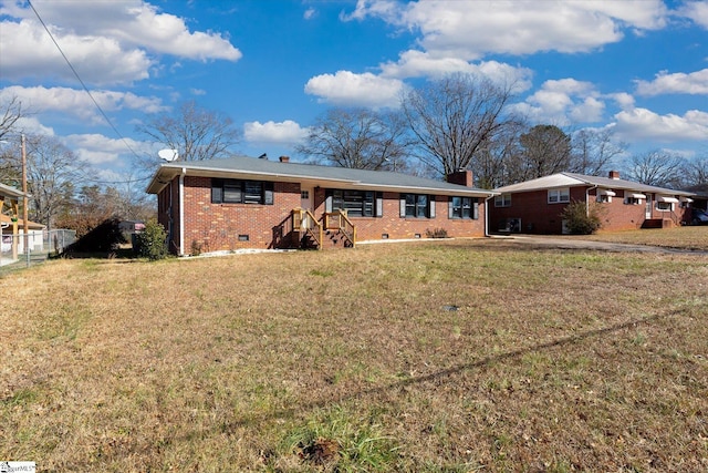 back of house with a lawn