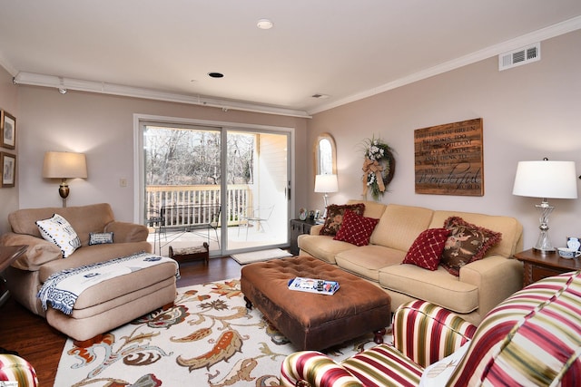 living room featuring wood-type flooring and ornamental molding