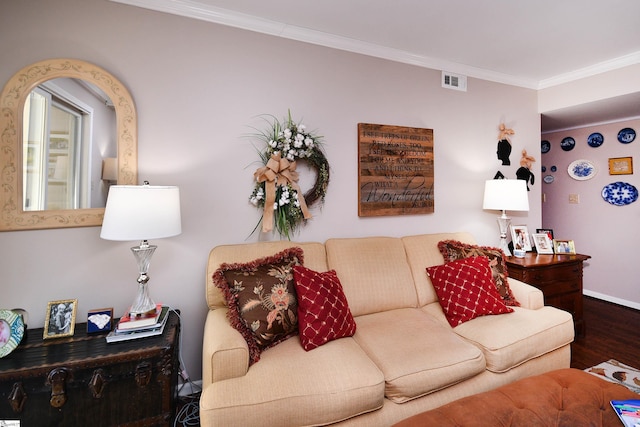 living room with ornamental molding and hardwood / wood-style floors