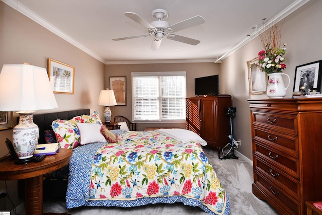 bedroom with ceiling fan, crown molding, and carpet flooring