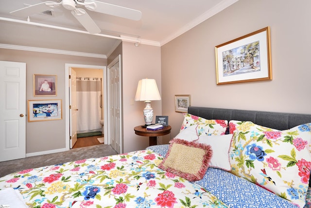 carpeted bedroom with connected bathroom, ceiling fan, and crown molding