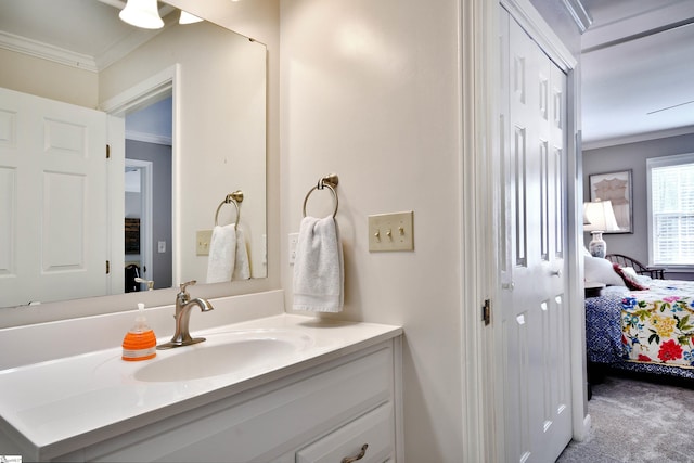 bathroom with crown molding and vanity