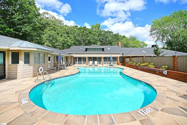 view of swimming pool with a patio