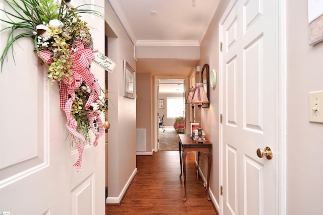 hallway with ornamental molding and dark hardwood / wood-style floors