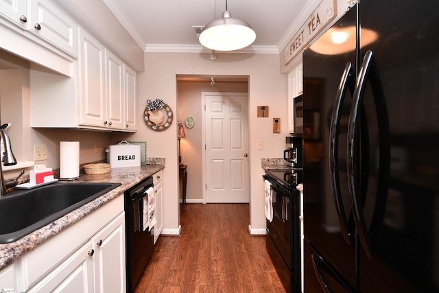 kitchen featuring sink, decorative light fixtures, white cabinets, ornamental molding, and black appliances