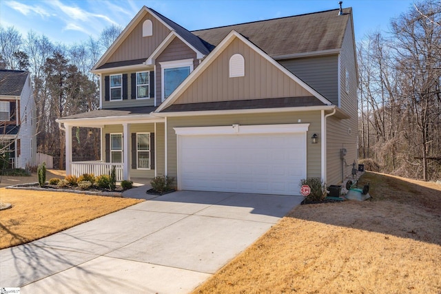 view of front of house with covered porch and a garage