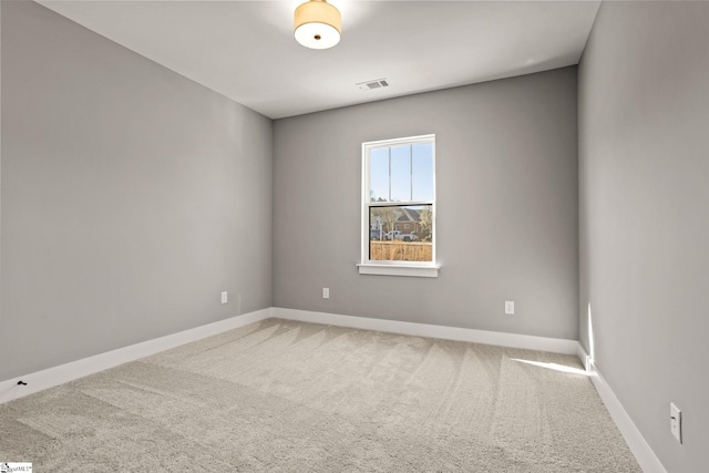 unfurnished room with carpet flooring