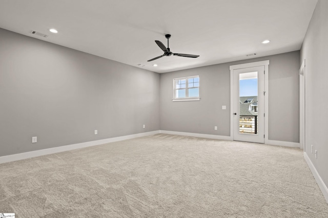 unfurnished room featuring ceiling fan and light colored carpet