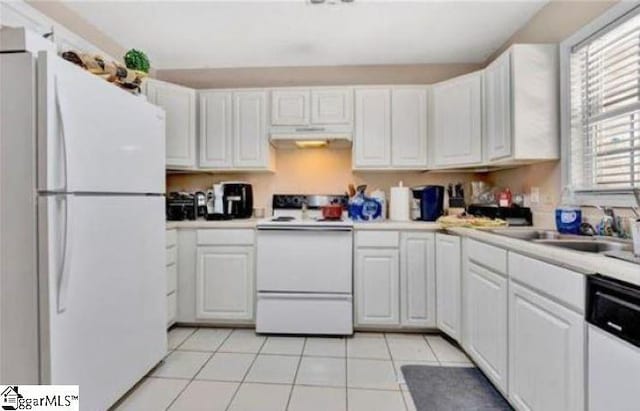 kitchen featuring sink, white appliances, white cabinetry, and light tile patterned flooring