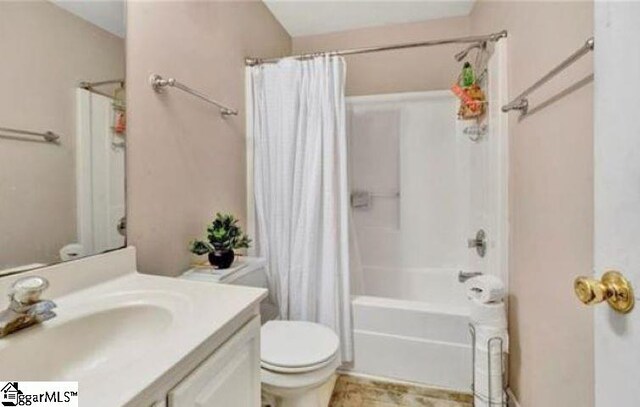 full bathroom with toilet, shower / tub combo with curtain, and vanity