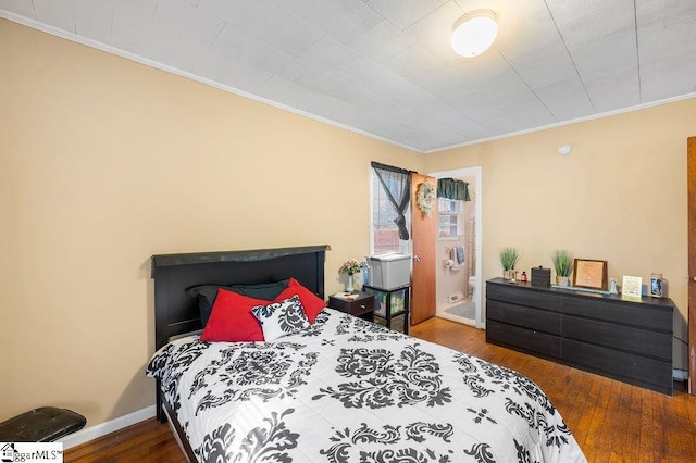 bedroom featuring hardwood / wood-style floors and crown molding