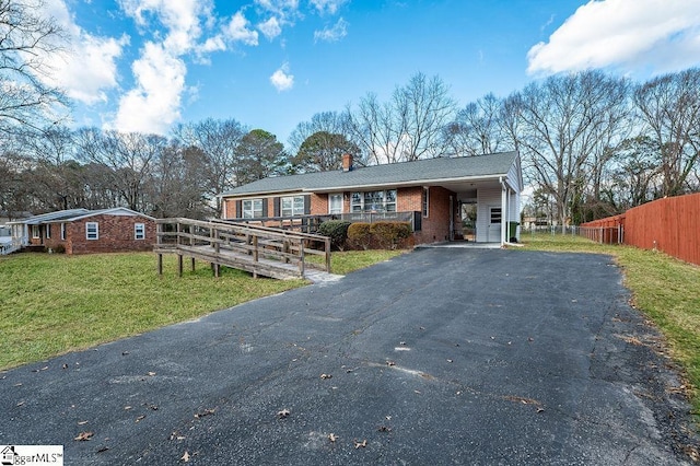 ranch-style home with a front yard