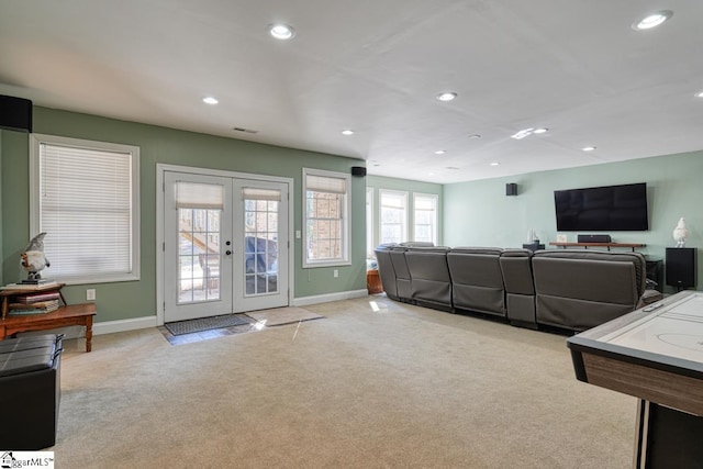 carpeted living room featuring french doors