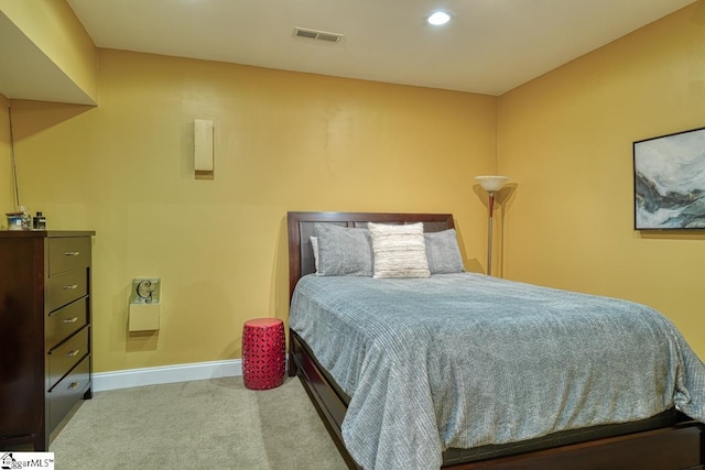 bedroom featuring light carpet