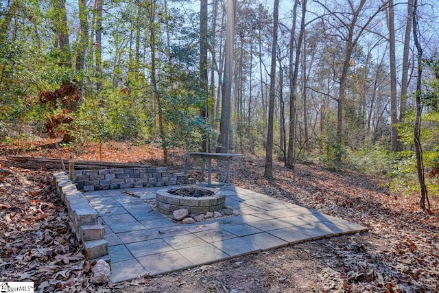 view of patio with an outdoor fire pit